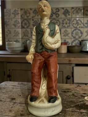 Hand-Painted Ceramic Farmer Figurine in Green and Brown 7”
